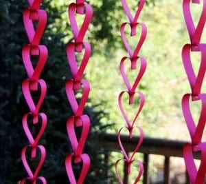 paper heart garlands hanging in window