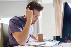 guy studying at home with a coffee