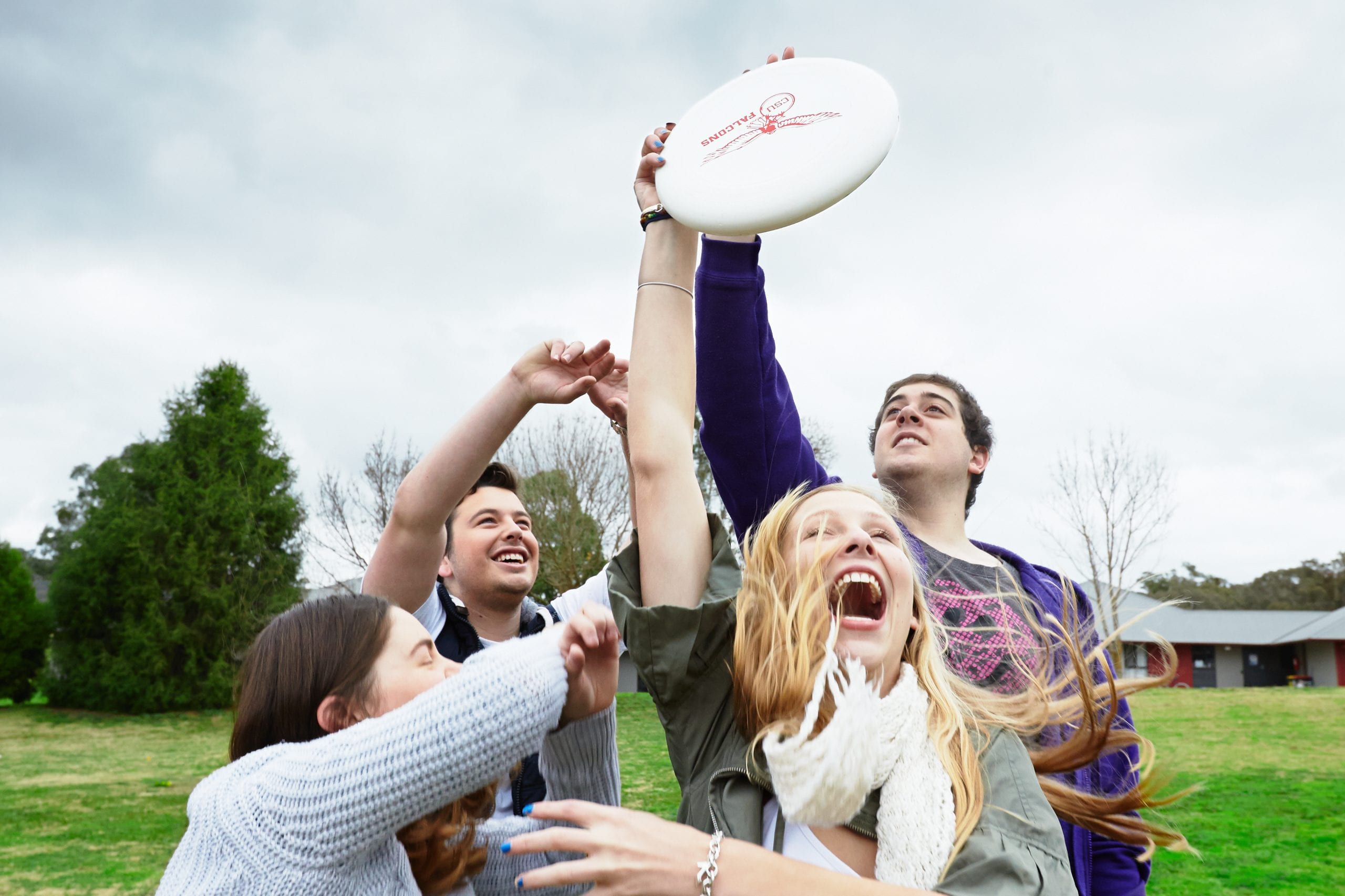 students playing with a frisbee