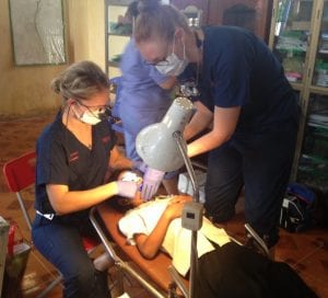 CSU oral health and dentistry students treat a patient in makeshift conditions