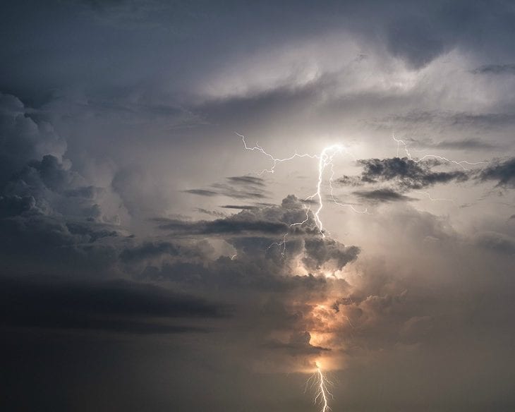 Dark clouds and lightning create a thunderstorm