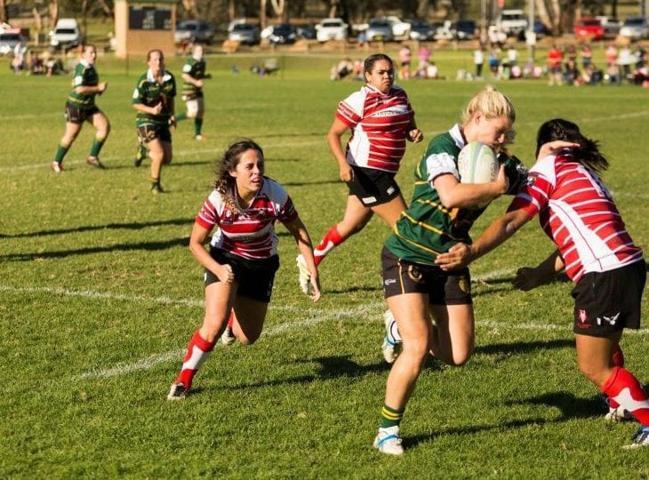 Elite Athlete Harriet Elleman makes a break in a women's rugby match