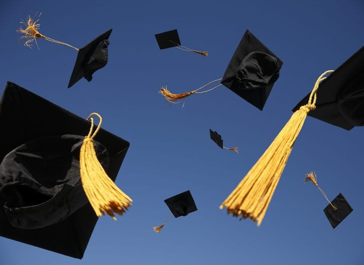 mortarboards in the air