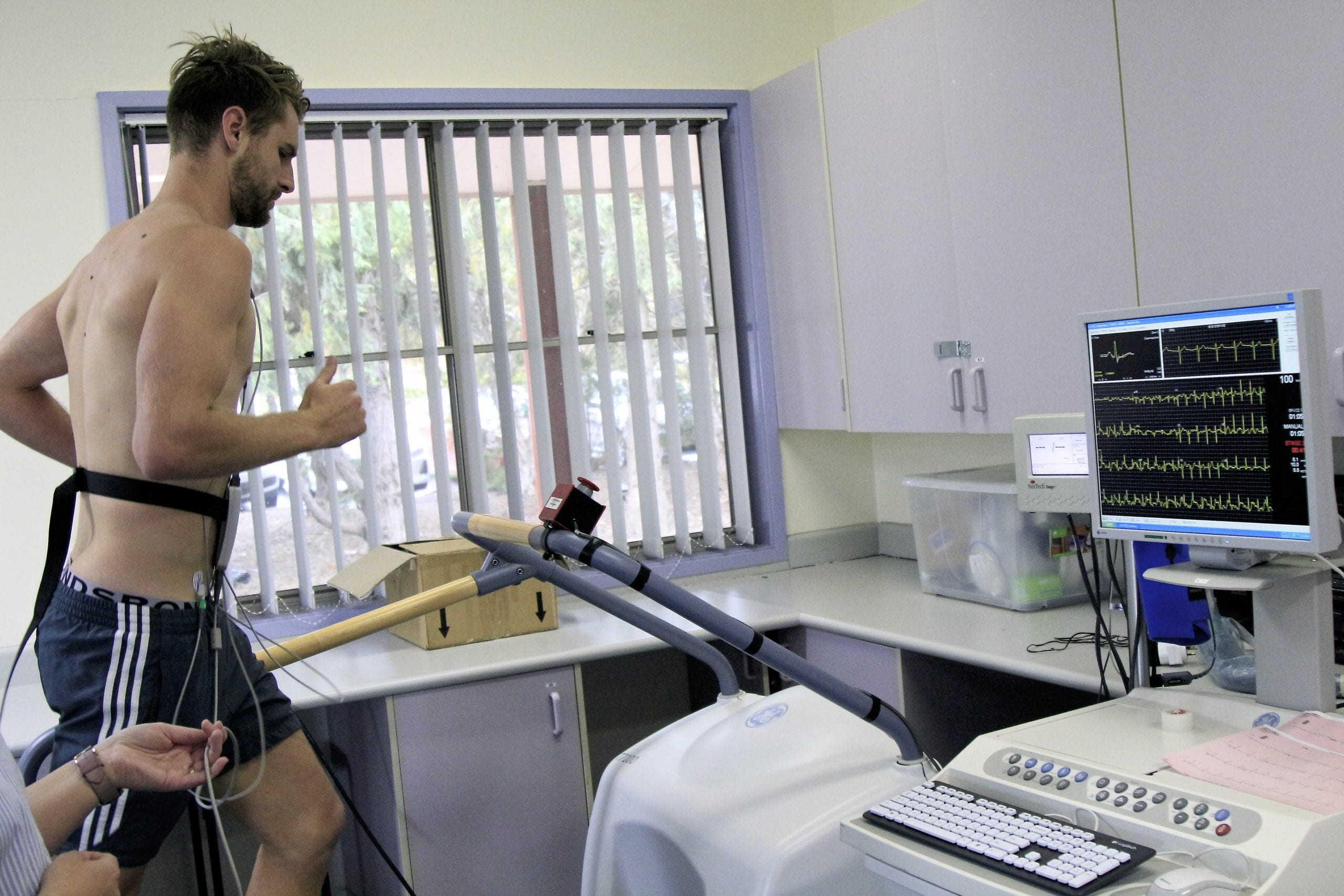 Harry Marsh jogging on a treadmill with machines hooked up