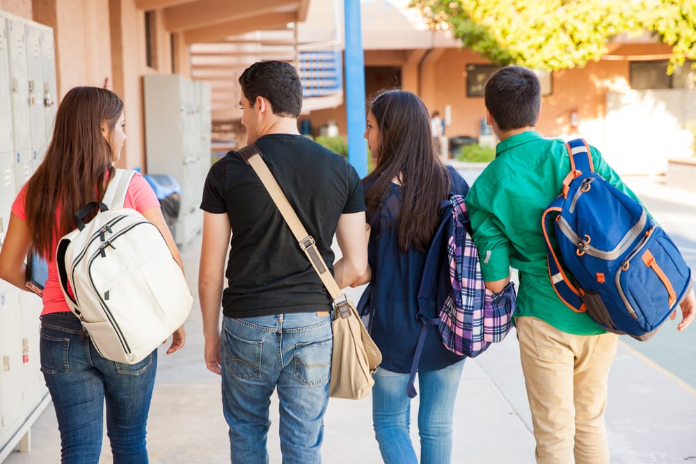 Students carrying backpacks