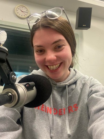 Sophie Norris in the 2MCE studios on Bathurst Campus, practicing her script before recording.