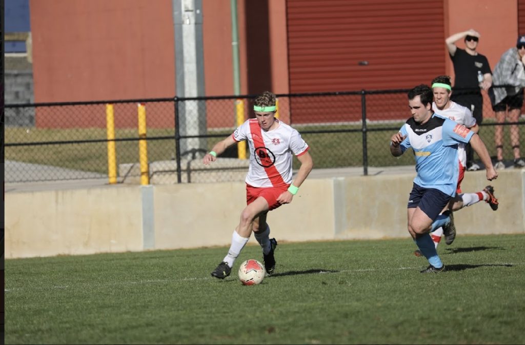 Isaac playing for the Charles Sturt University Football Club.