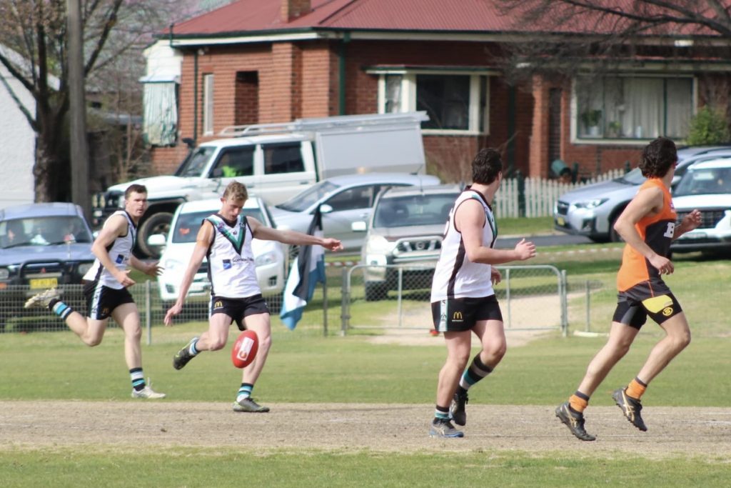 Isaac playing AFL.