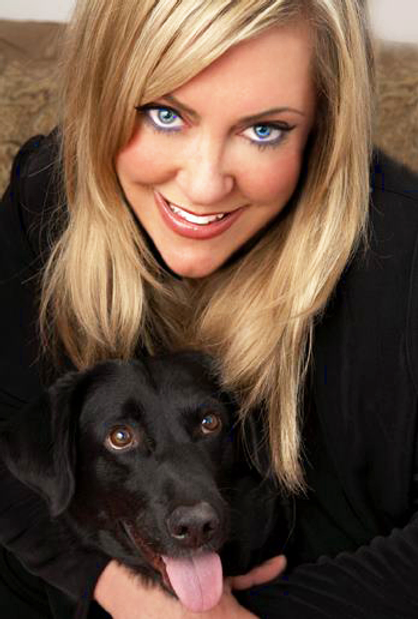 Colleen Paige and a dog [Photograph taken from her website].