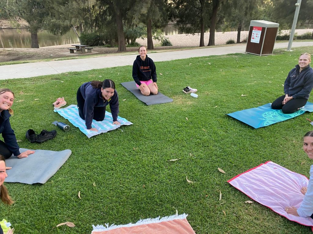 Yoga on the grass near Wagga Beach.