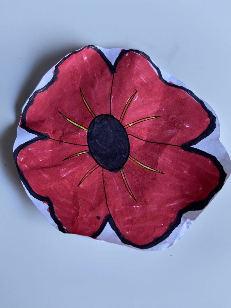 A poppy decorated by Michelle's youngest child at school.