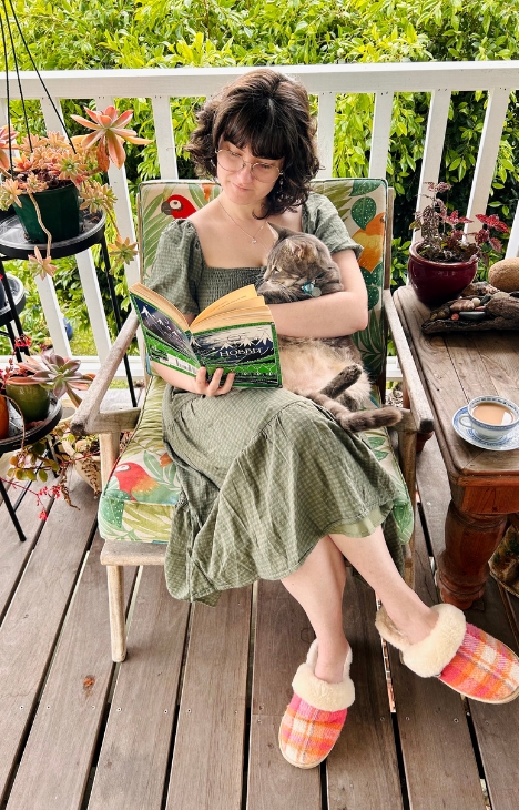 Eliska and her cat reading The Hobbit. 
